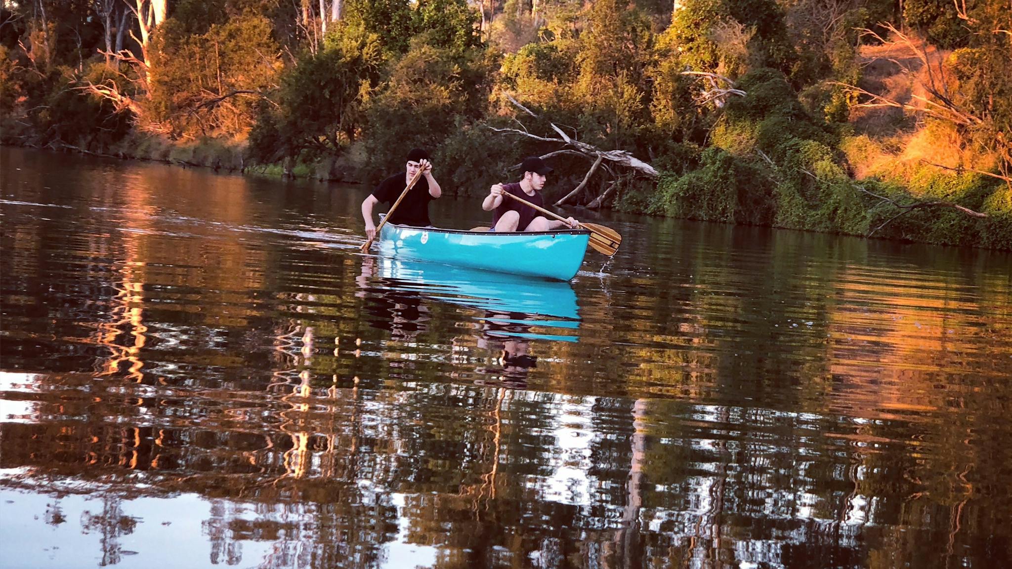 Canoe paddling river