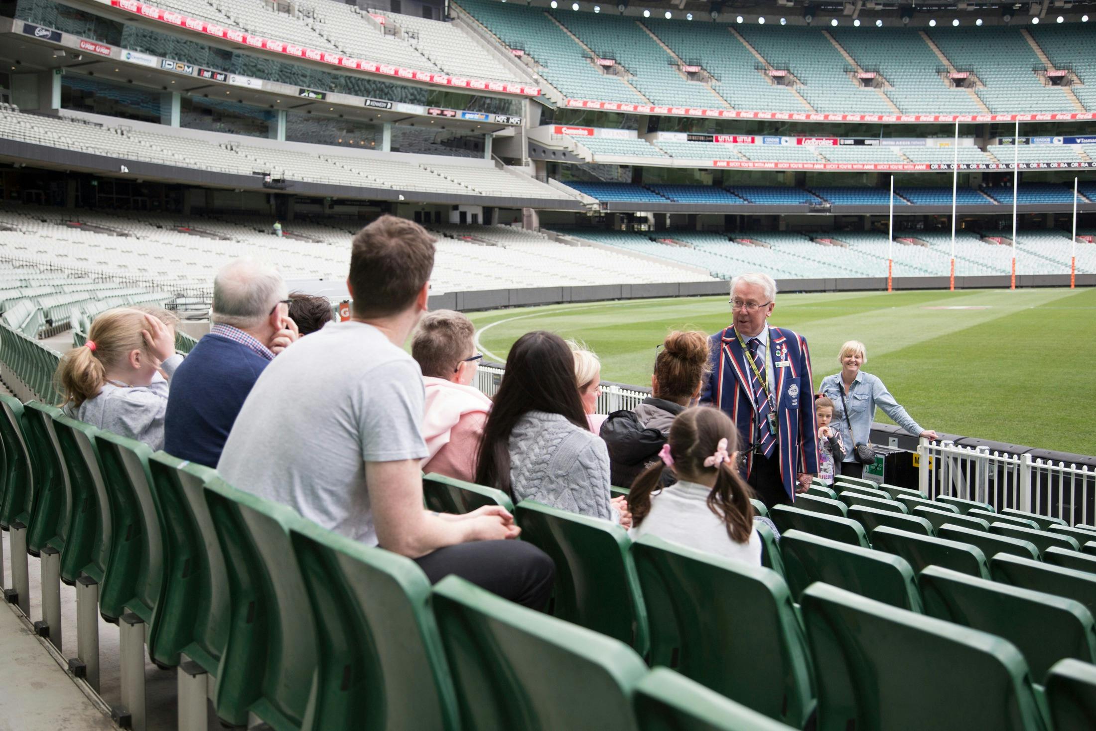 MCG Tour guide with group in the famous arena
