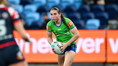Canberra Raiders NRLW player Elise Simpson running the ball.