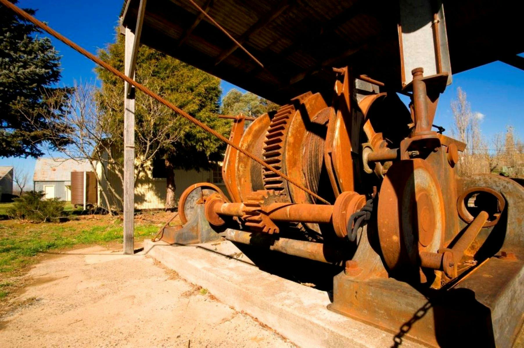 Rusted old machinery under a shelter