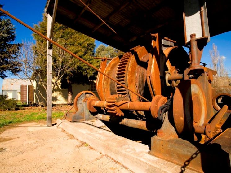 Rusted old machinery under a shelter
