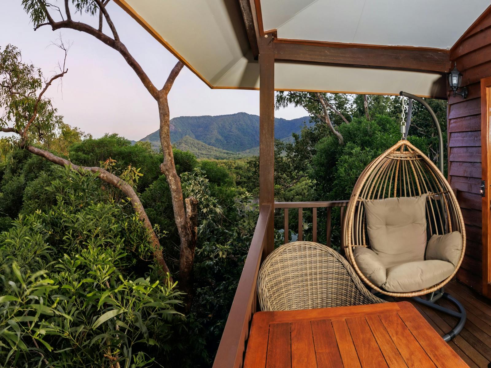 Balcony with hanging chair and ocean view Balcony with hanging chair and ocean view