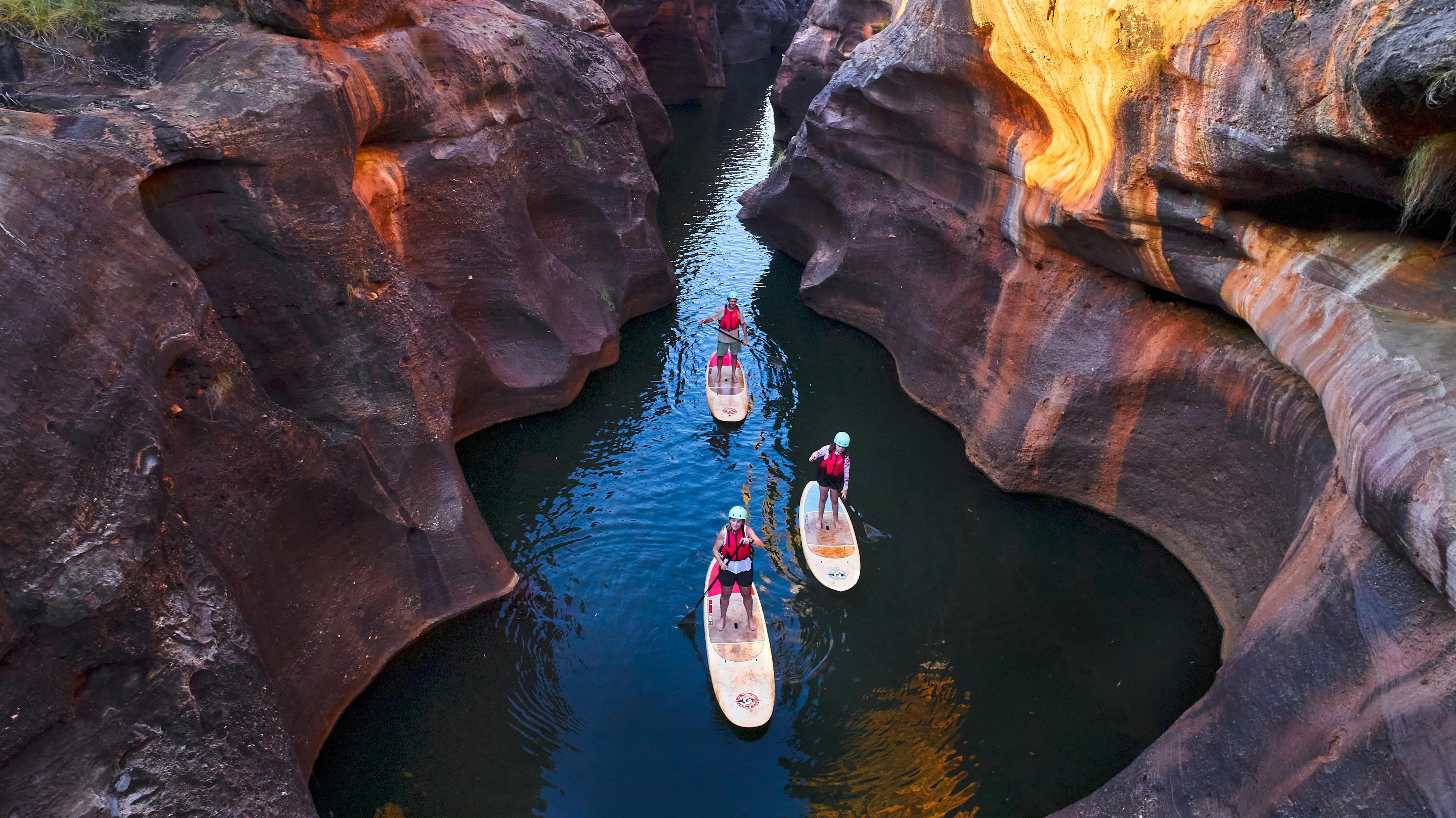 3 guests on SUP boards at Cobbold Gorge