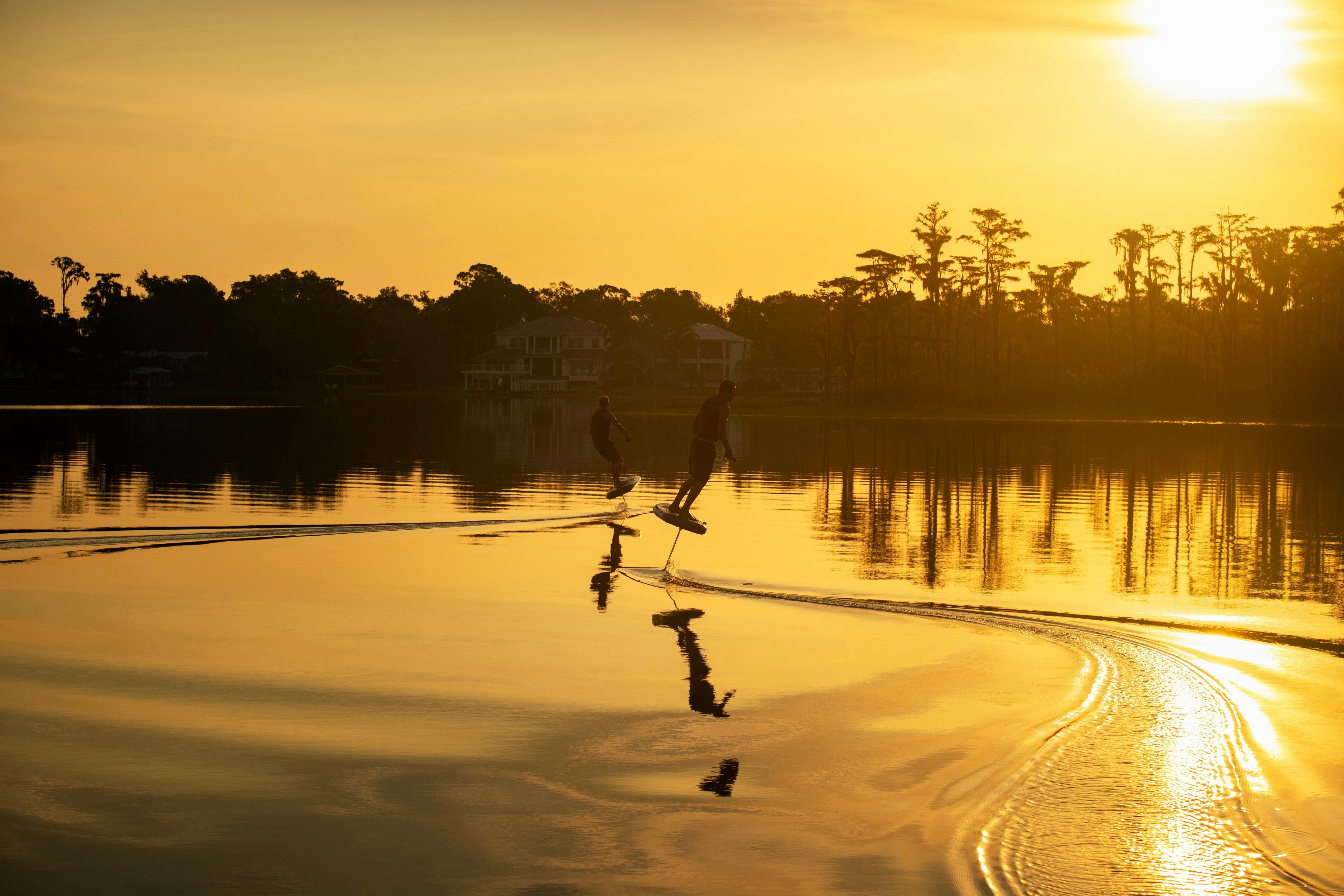 Couple Efoiling with Fliteschool Noosa at Sunset