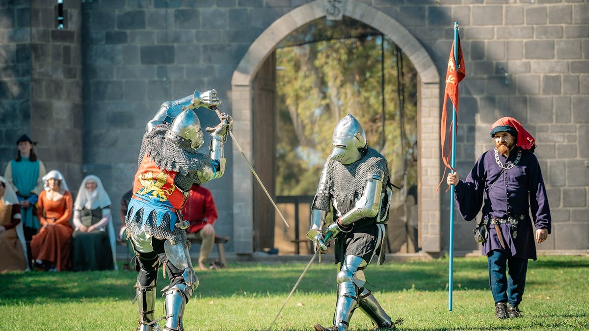 two knights in suits of armour in combat in the Castle Arena