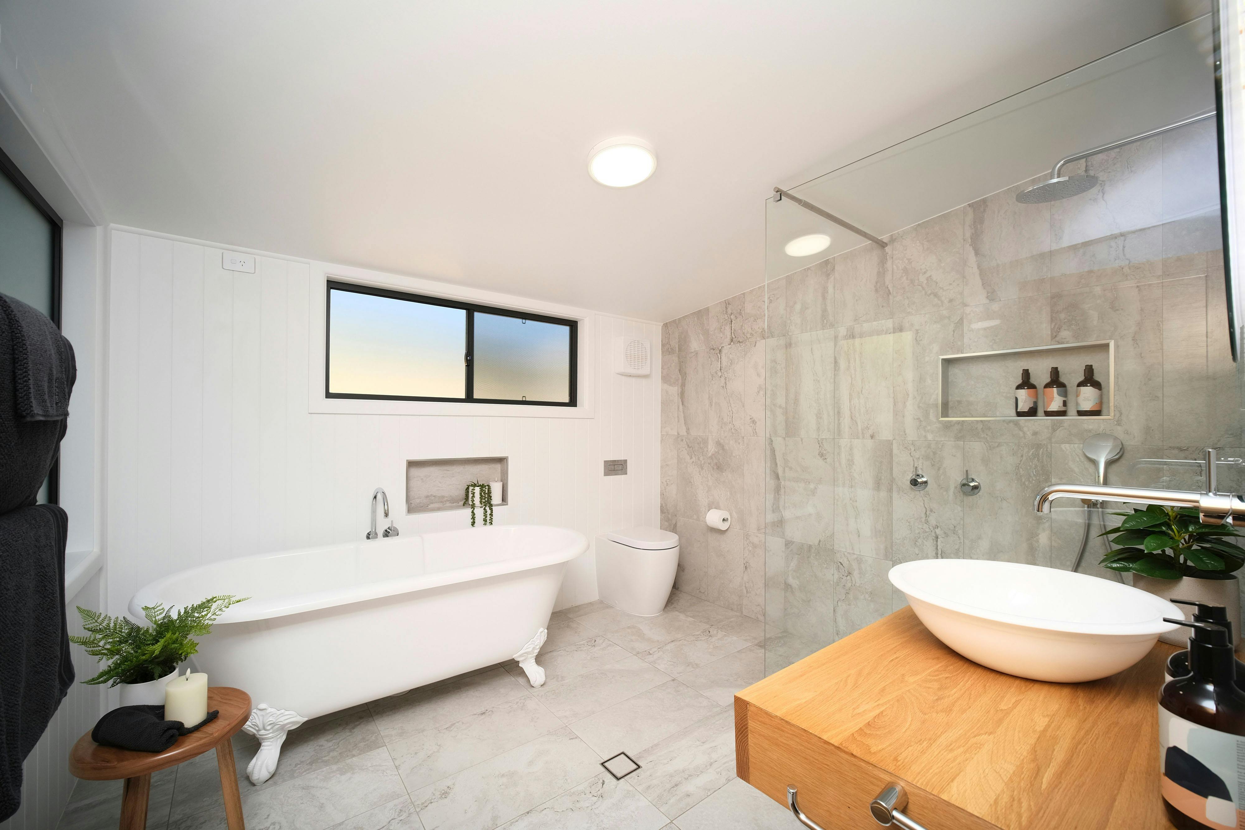 Deep clawfoot bath and walk-in shower