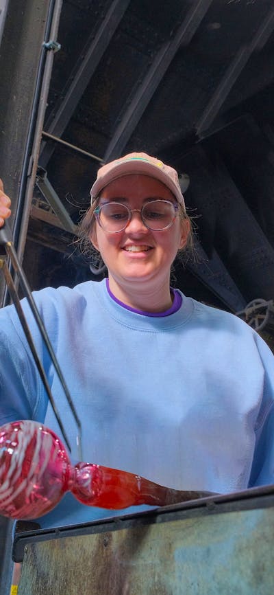 Participant glass blowing in MYO class