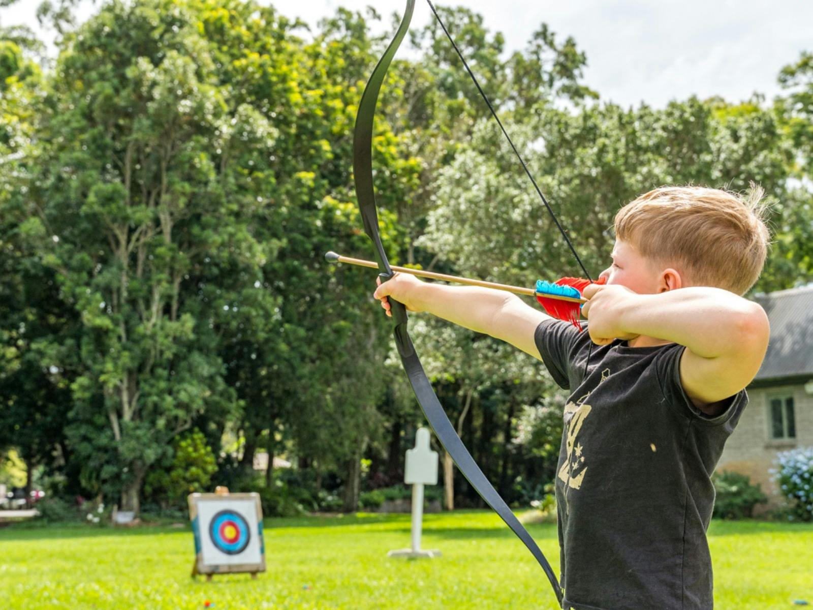 Practise archery on the lawn outside the Abbey Museum.