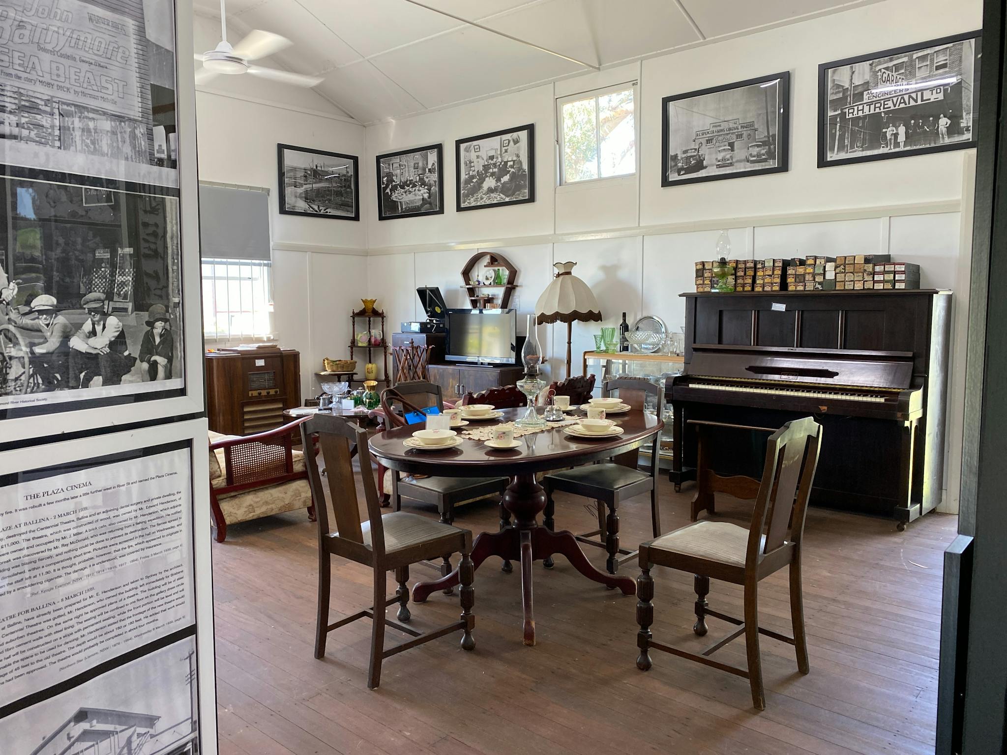 Old furniture and framed pictures inside museum/hall