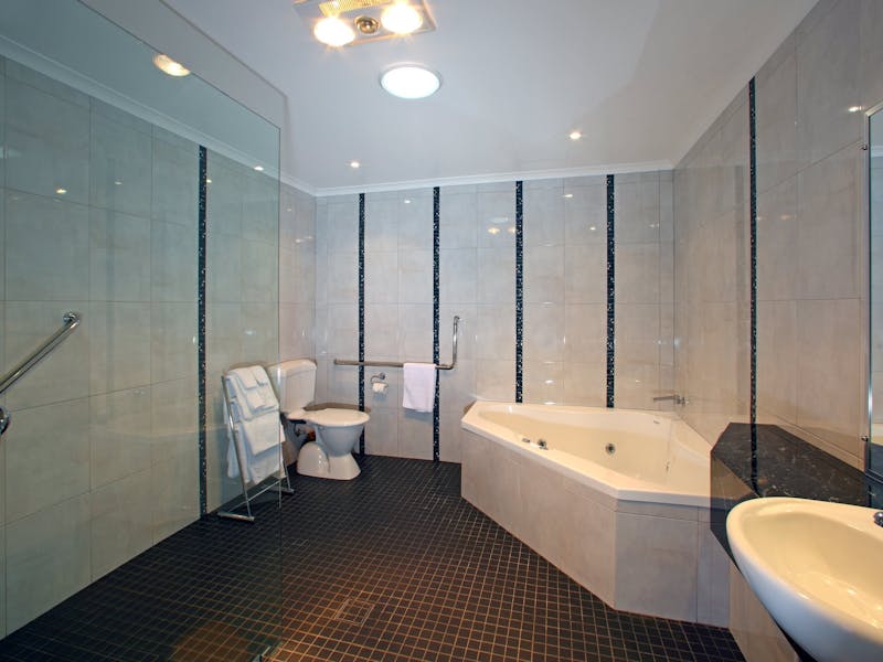 Large bathroom with 2 person spa and walk in shower