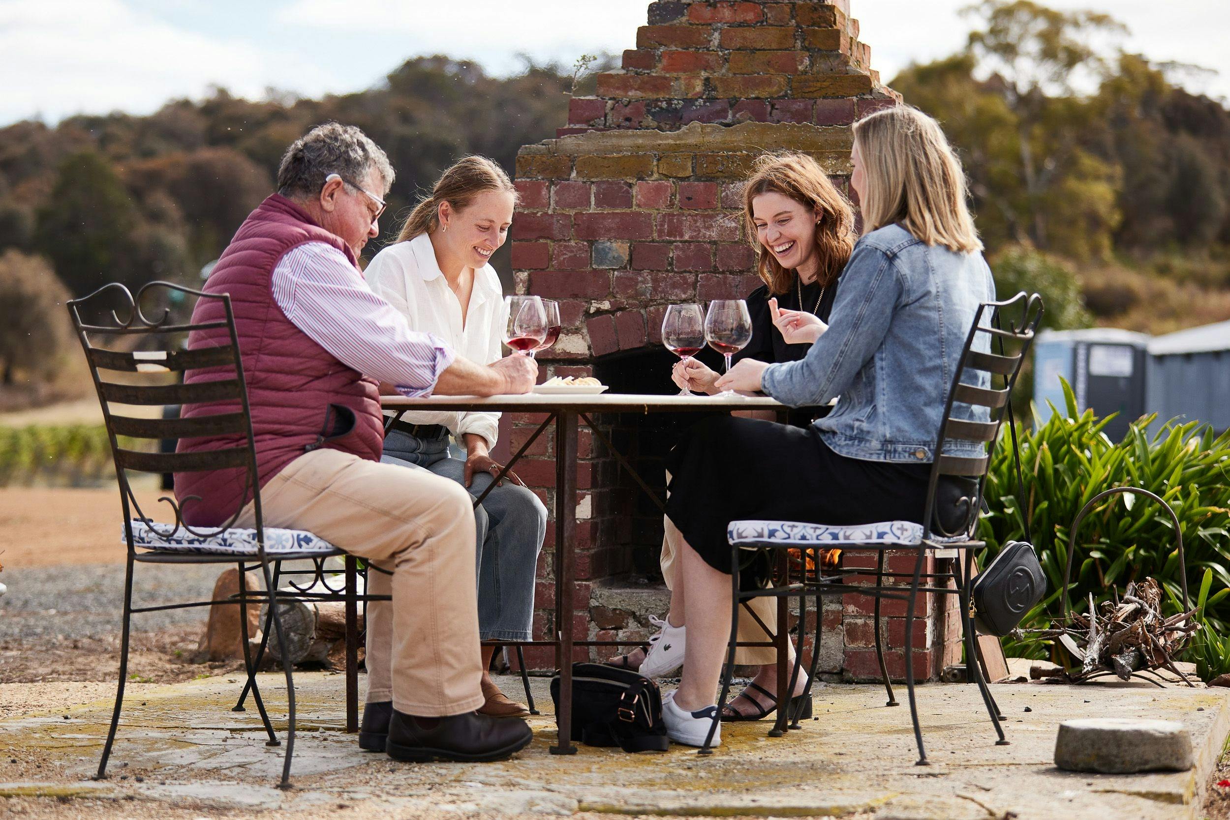 Guest enjoying the sunshine and wine tasing at Brinktop Wines, near Hobart, Tasmania