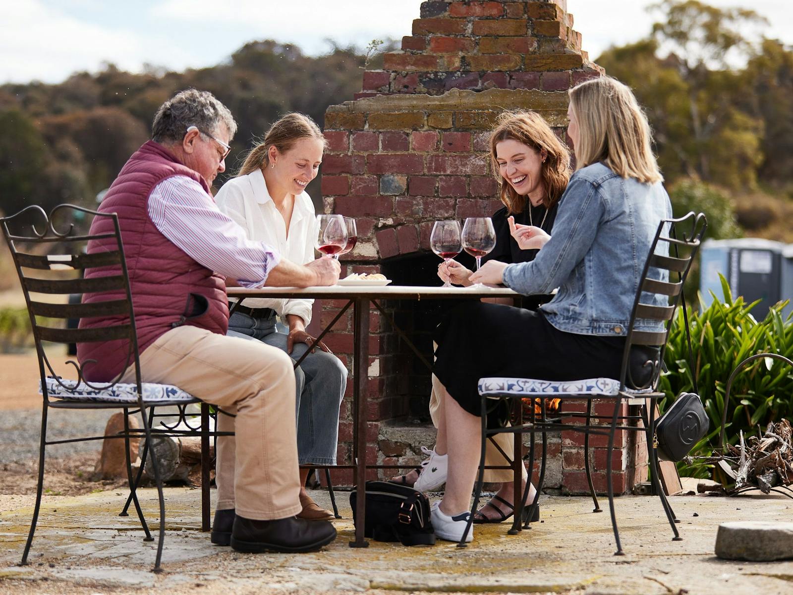 Guest enjoying the sunshine and wine tasing at Brinktop Wines, near Hobart, Tasmania