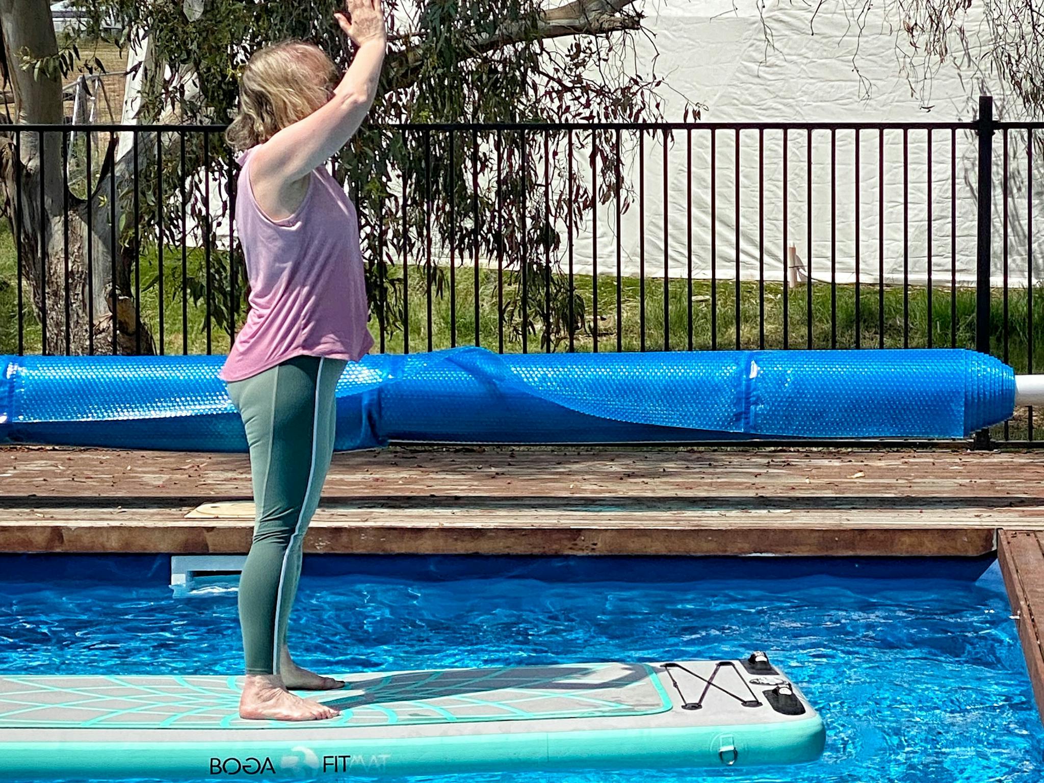 Woman on Paddleboard doing yoga