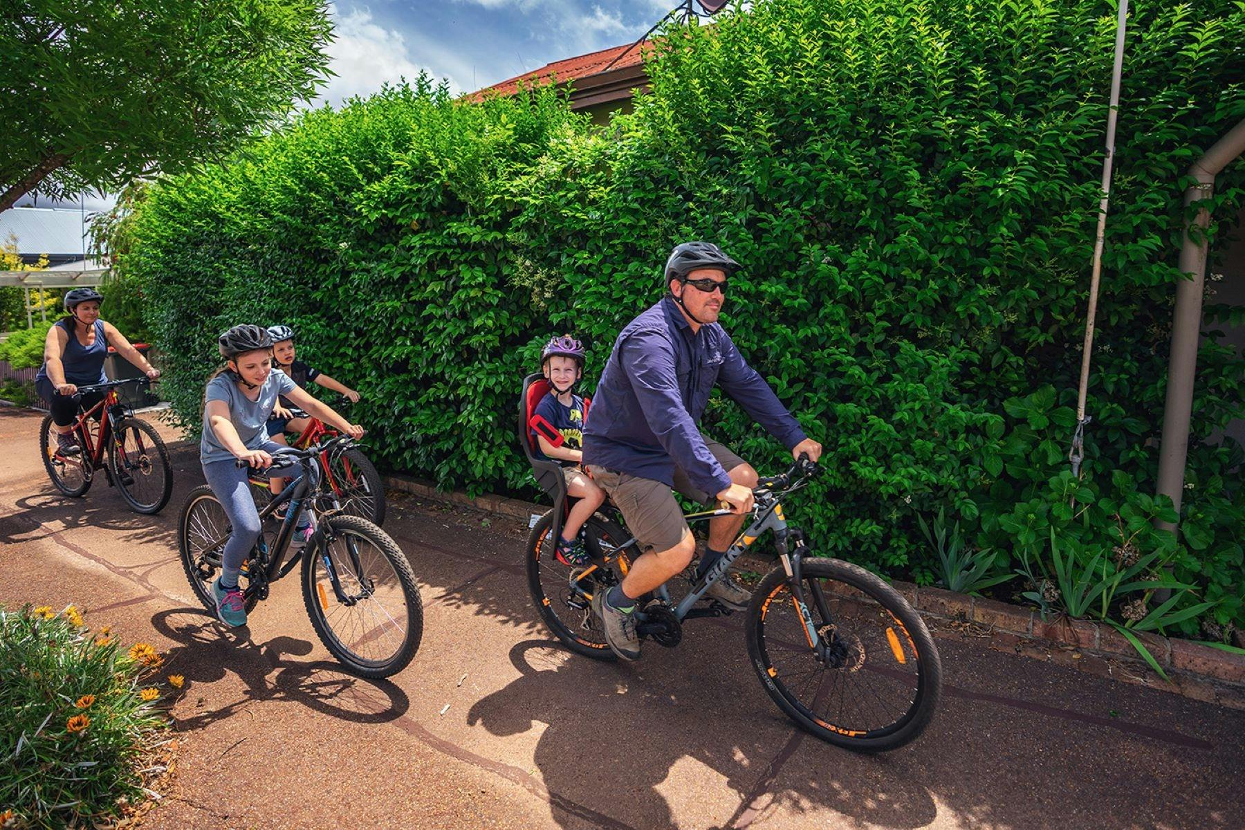 Family riding with child in carrier