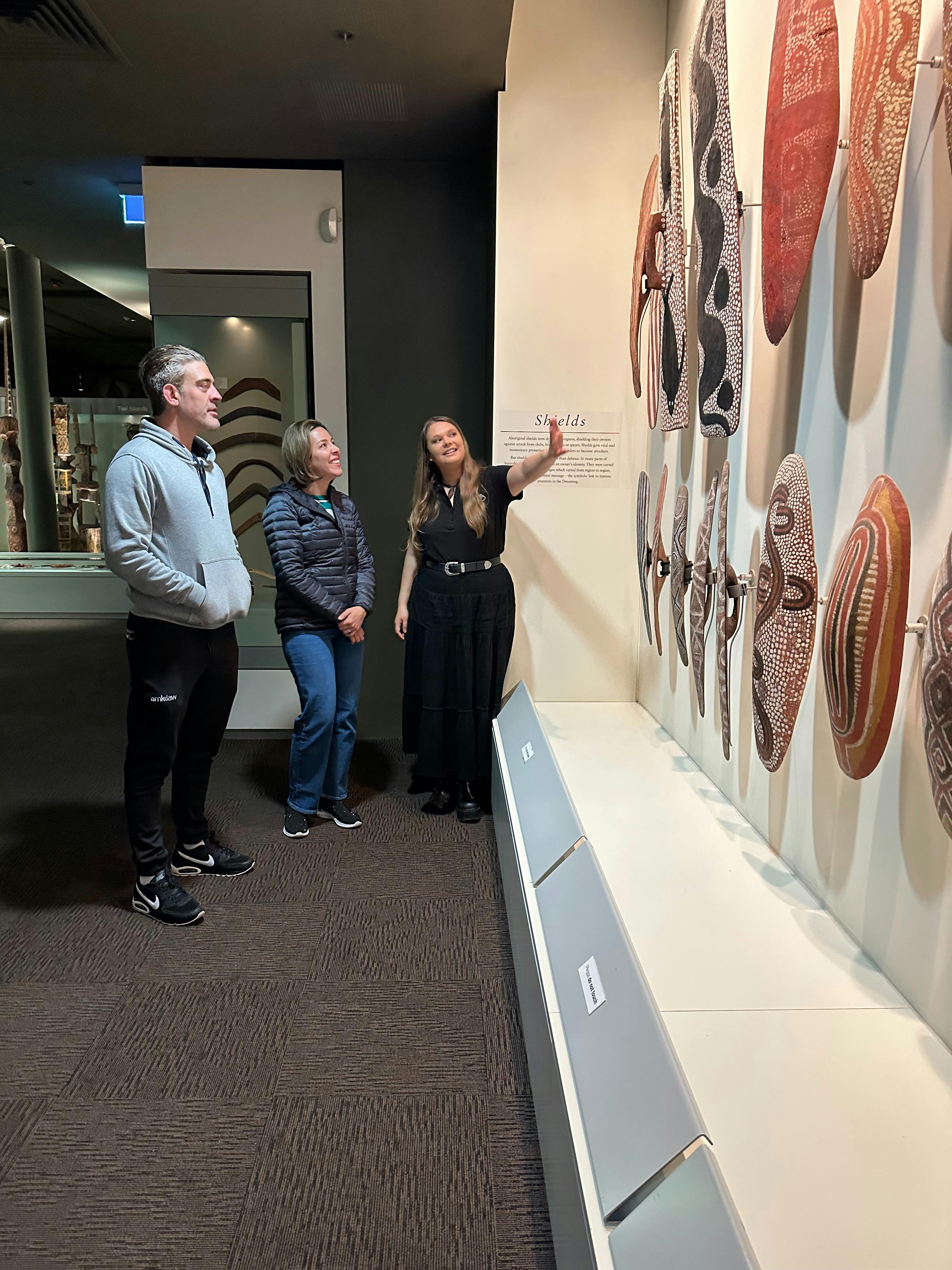 Iteka ukarla shows guests the shields in the Aboriginal Cultures Gallery at the South Aust Museum