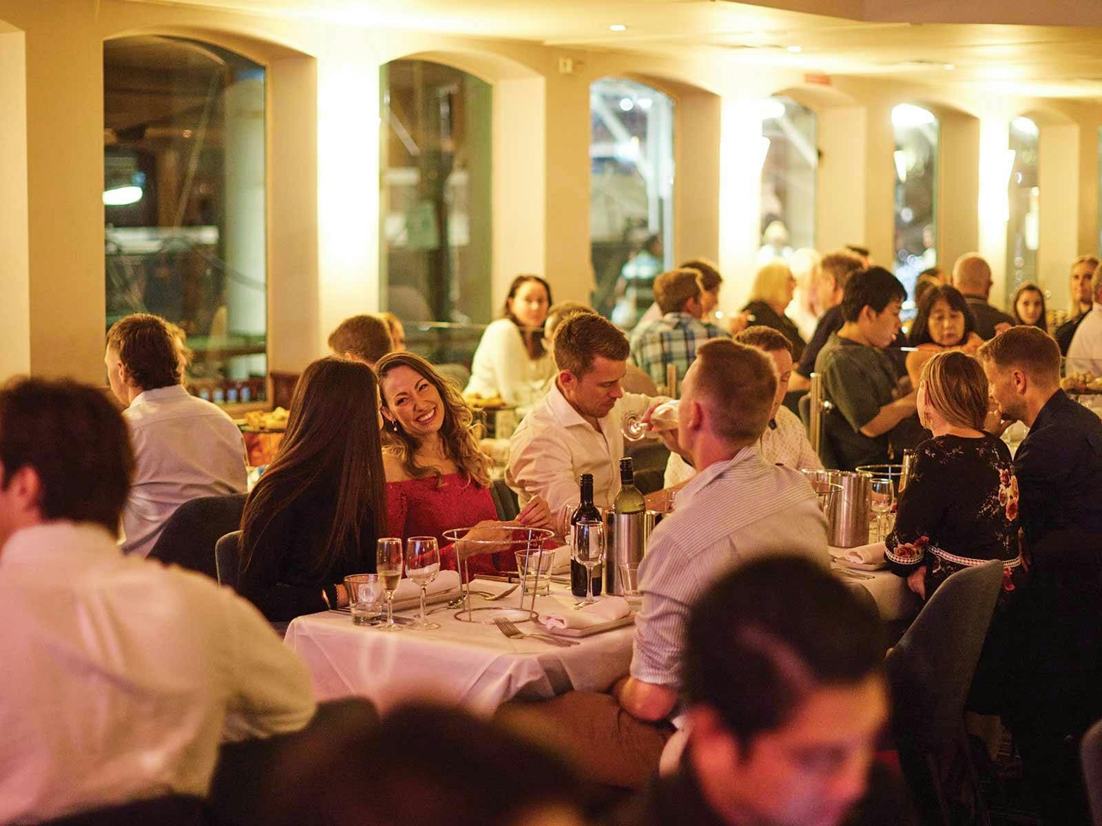 Guests enjoying their dinner aboard the Showboat Dinner Cruise