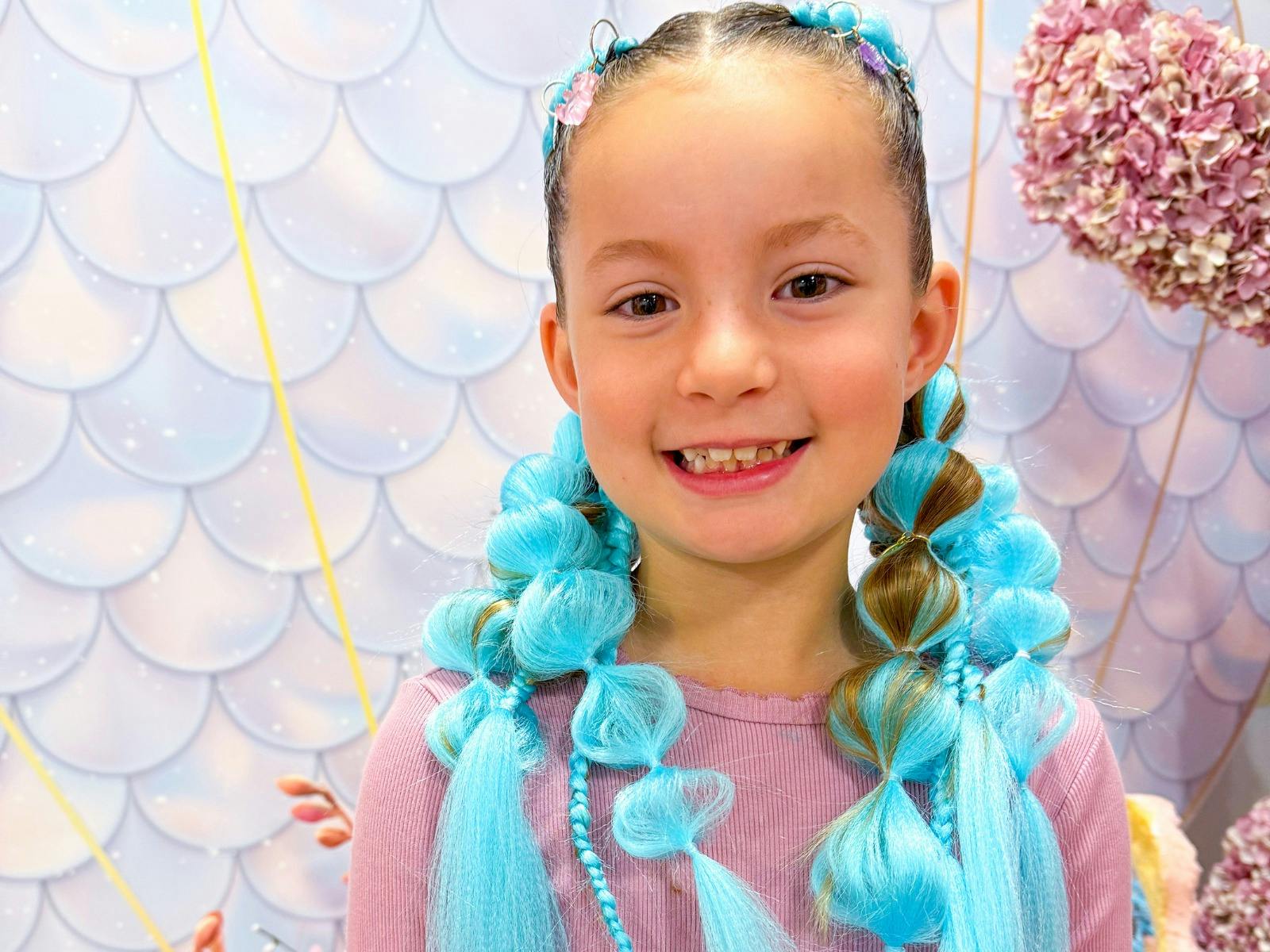 Girl with hair braid and blue extensions