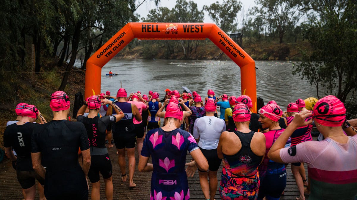 Swimmers entering the MacIntrye River via the boat ramp