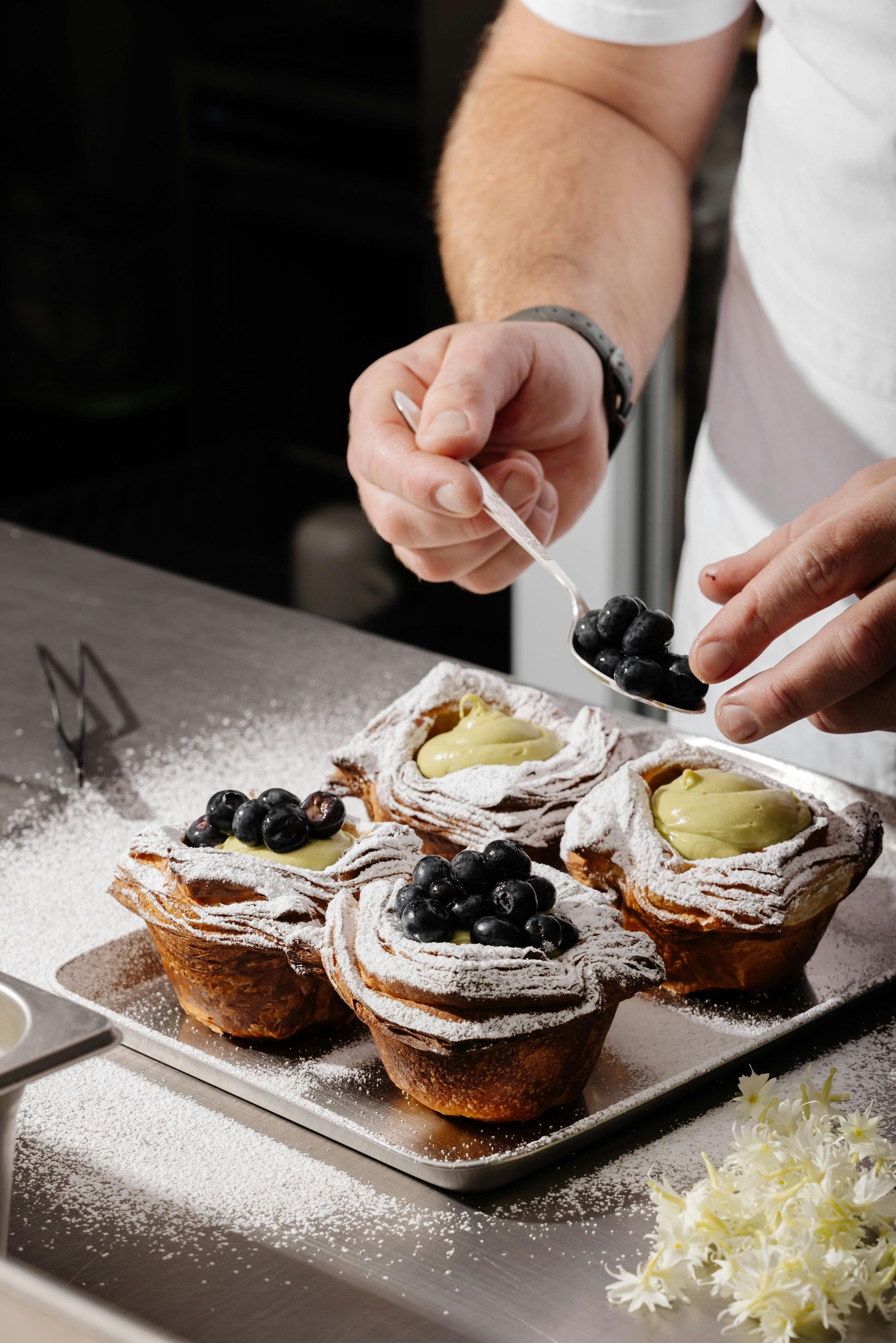 Tray of blueberry-topped pastries at Crumb