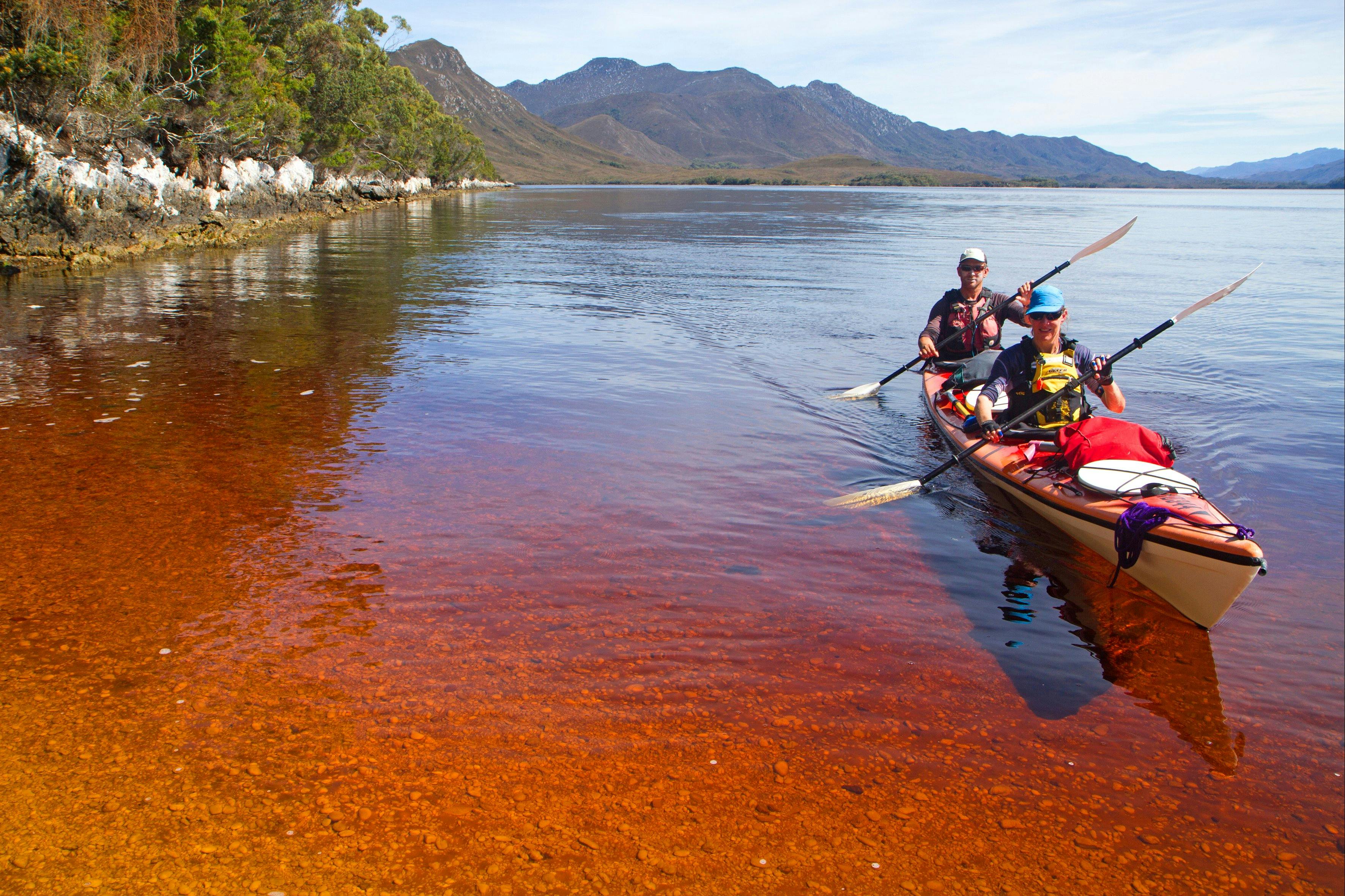 Kayakers near Balmoral Beach, Southwest Tasmania