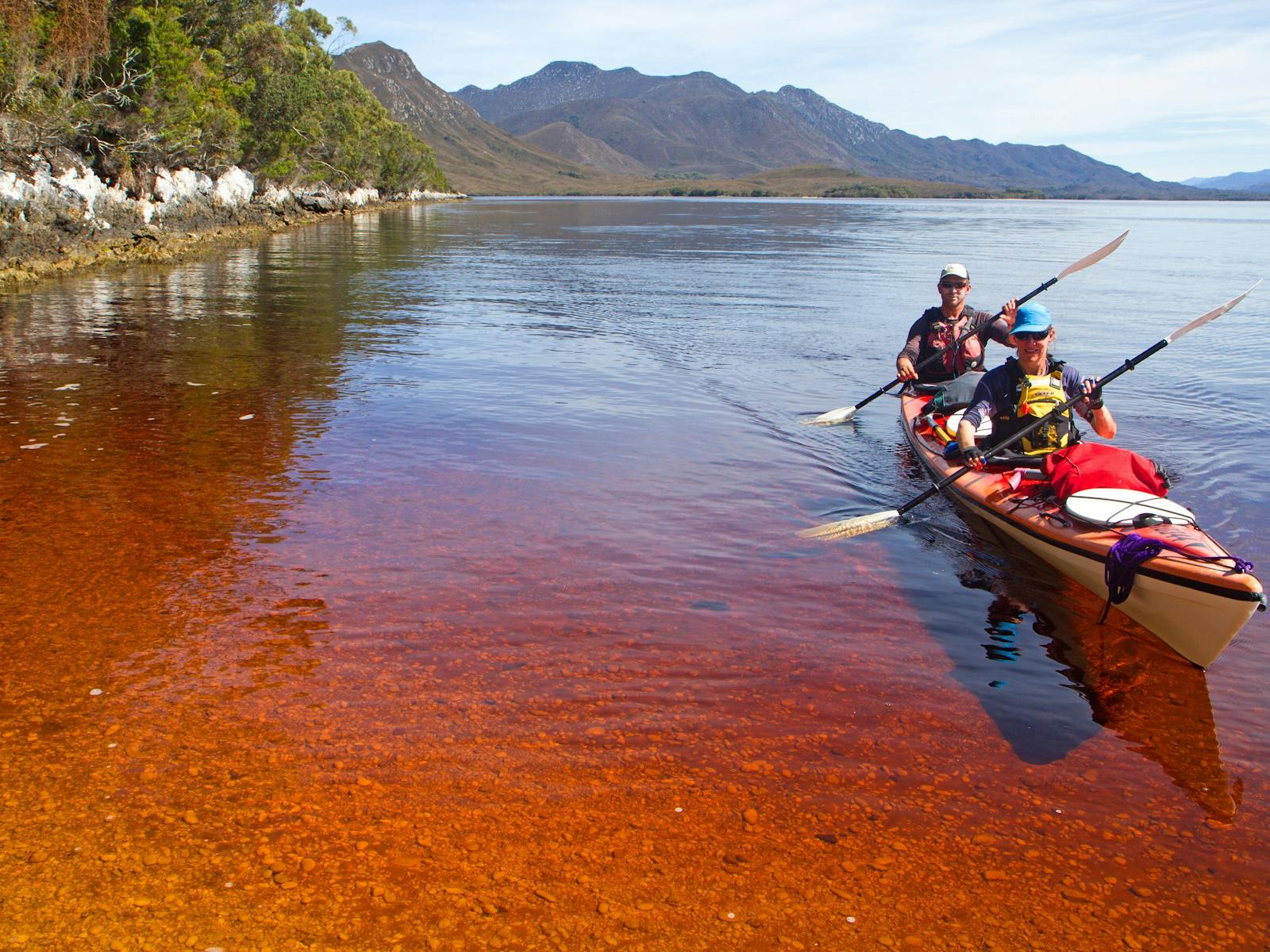 Kayakers near Balmoral Beach, Southwest Tasmania