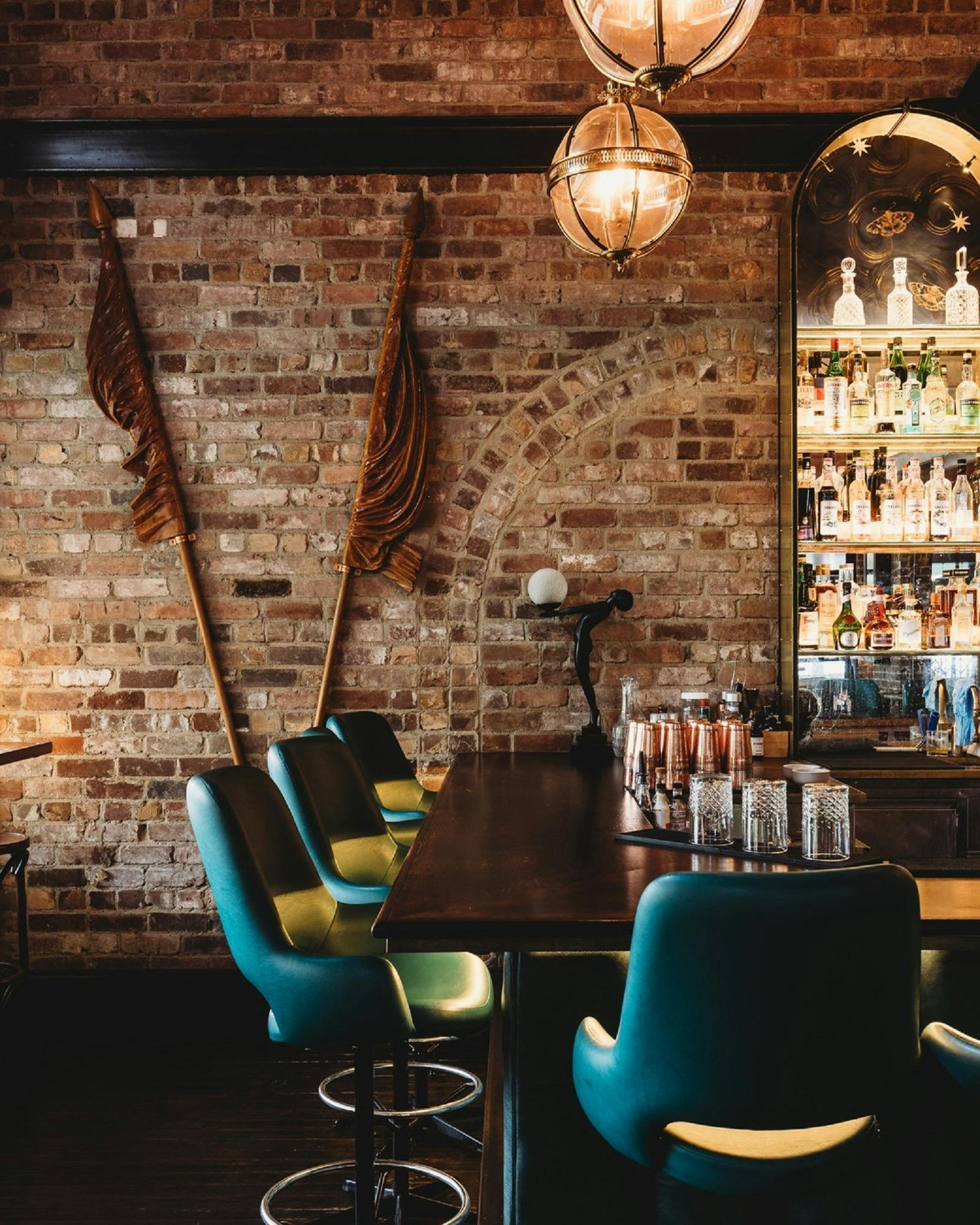 Bar stools and brown flags decorating back wall