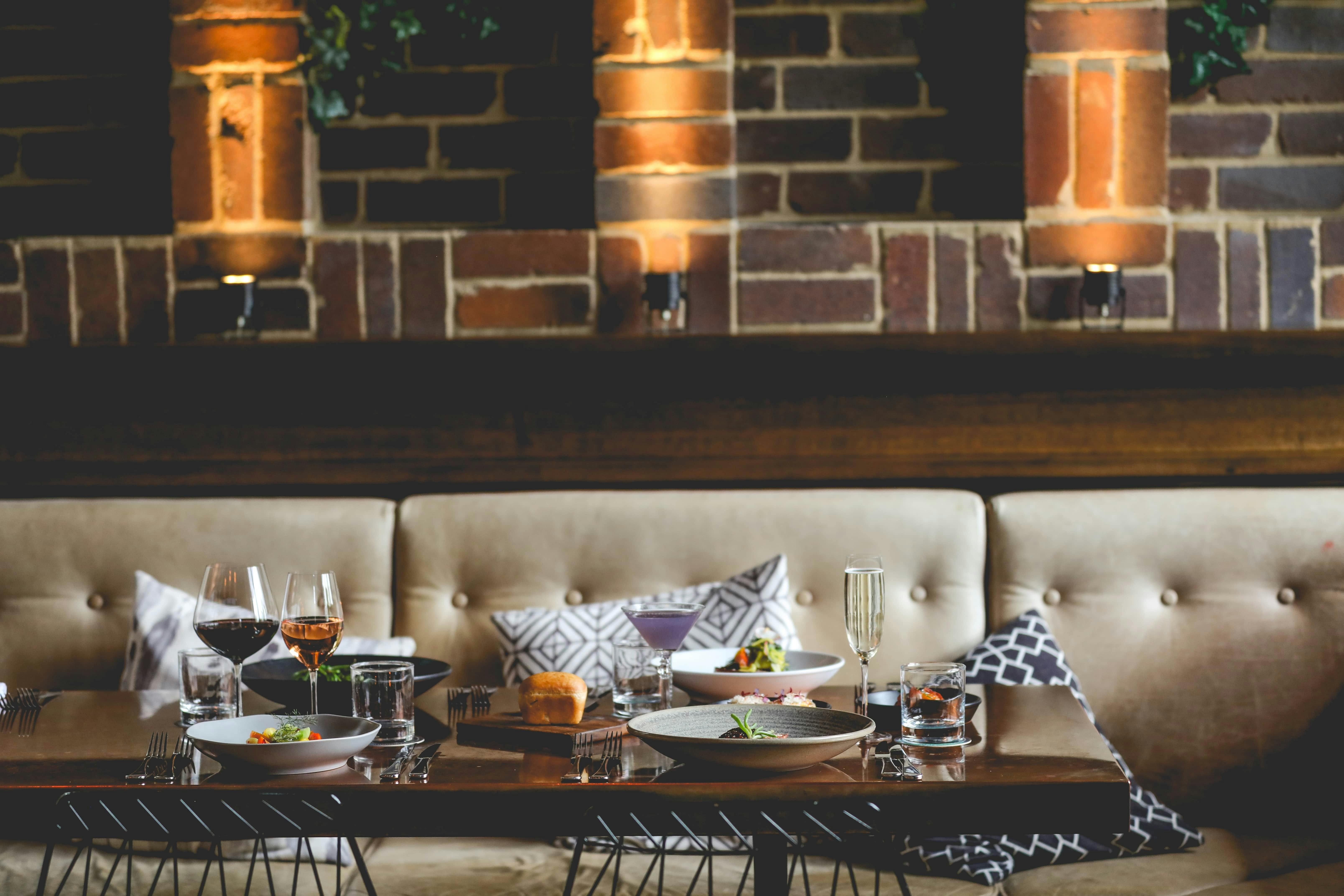 A table in the dining room with several delicious dishes and drinks
