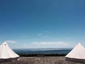 Two Wandering Souls Australia belltents overlooking Bay of Shoal wineries sea and vines