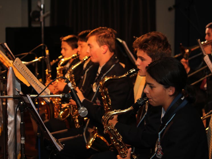 Young band musicians with their saxophones