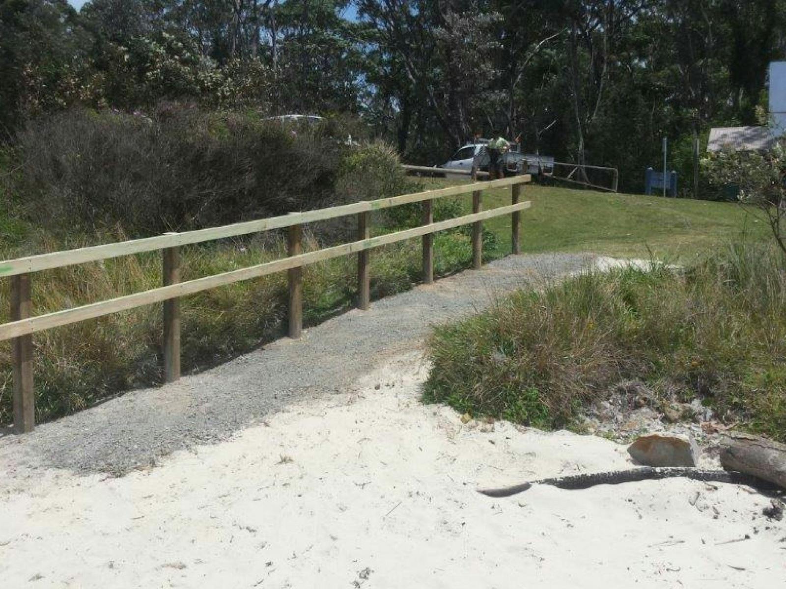 Beach access includes a ramp and handrail.
