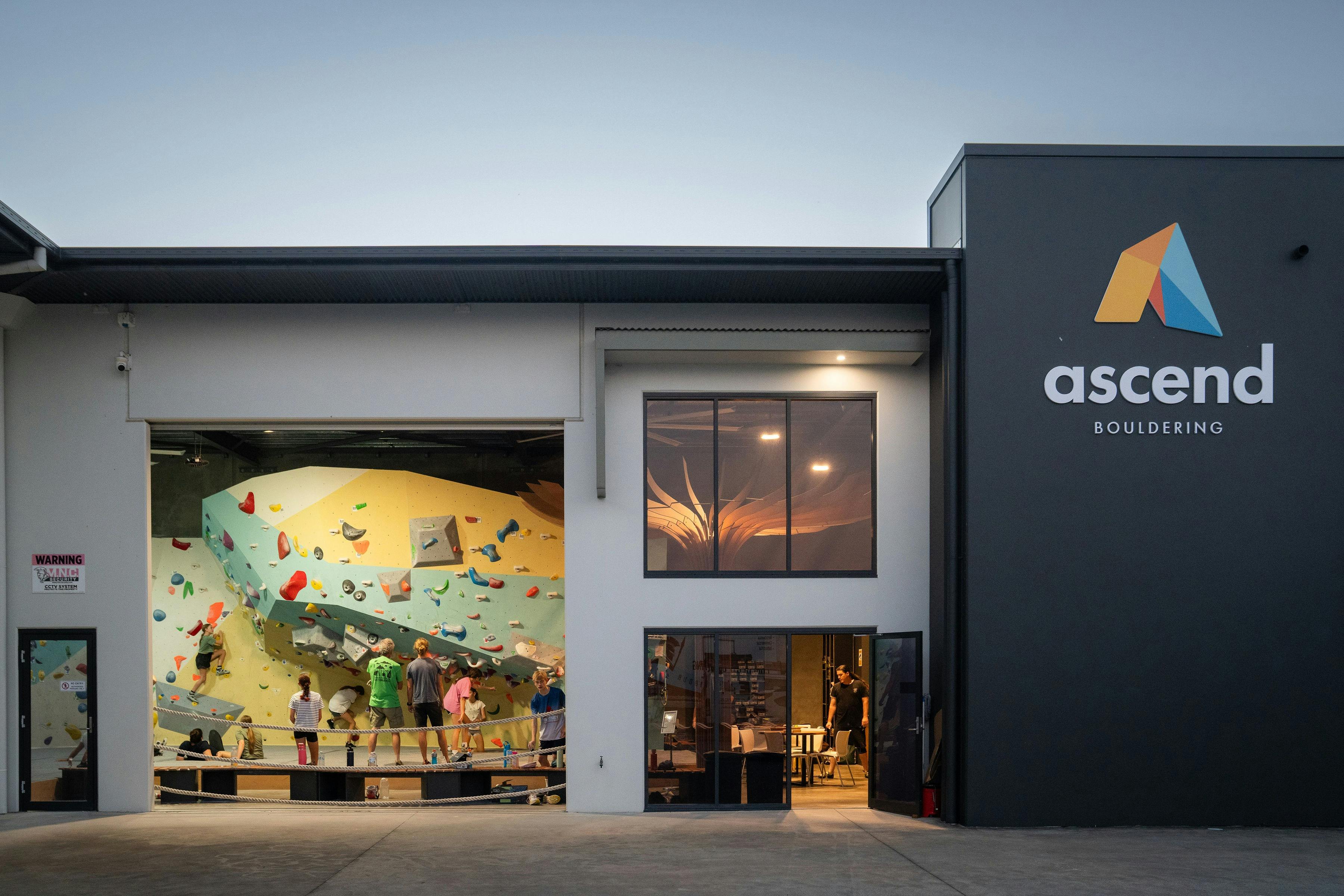 It is a picture of ascend Bouldering venue on dusk taken from outside the building.