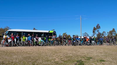 People standing in front of shuttle bus
