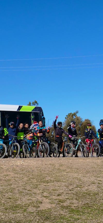 People standing in front of shuttle bus