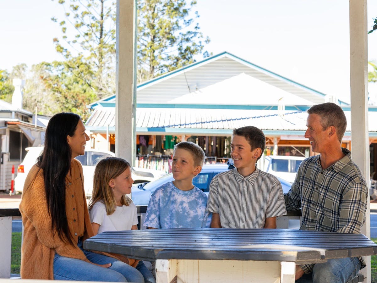 Family sitting at the rotunda in the middle of town