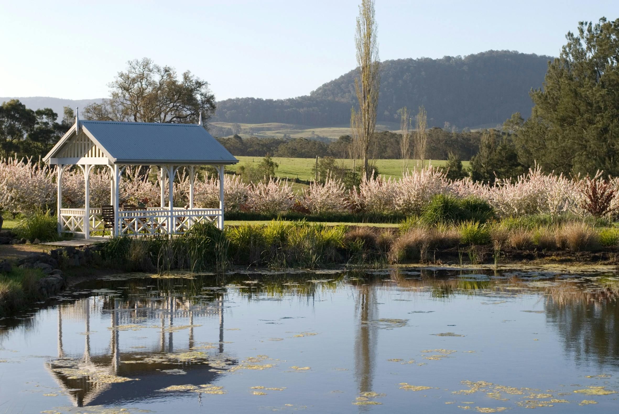 Dam with summer house on the left and view of Kangaroo Valley escarpment in background