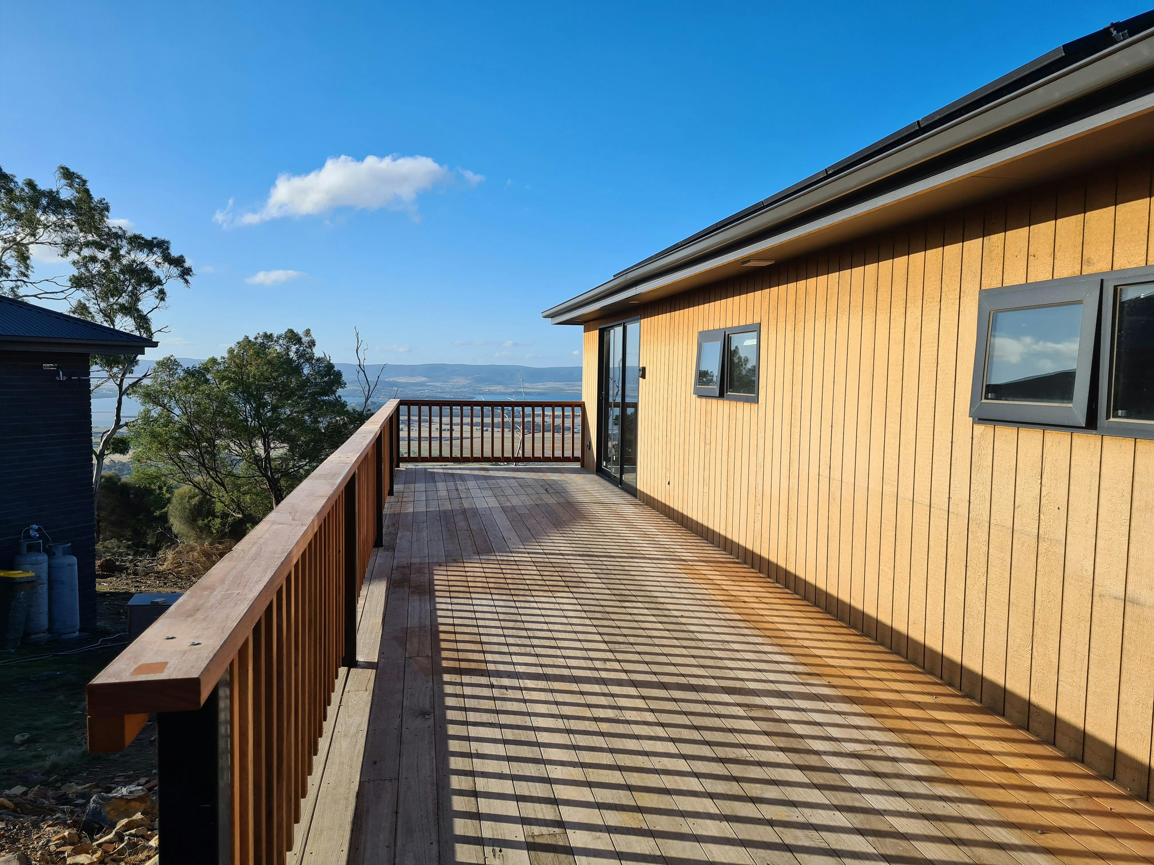 Timber deck overlooking the surrounding Tasmanian landscape