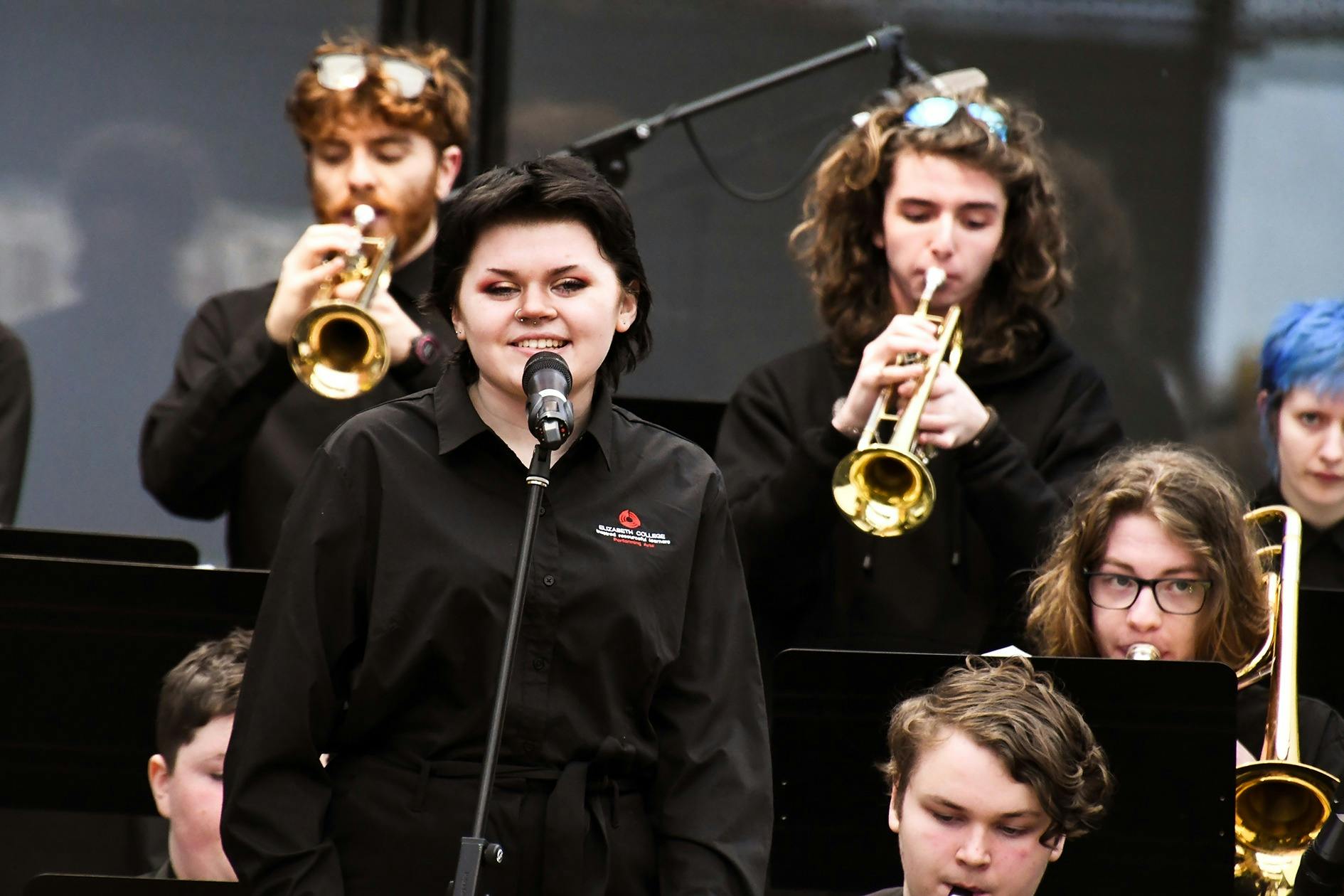 young singer with student musicians