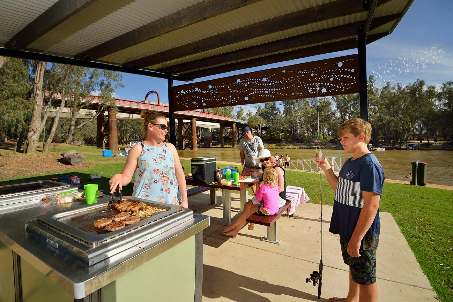 Family enjoying a BBQ at Moama Beach