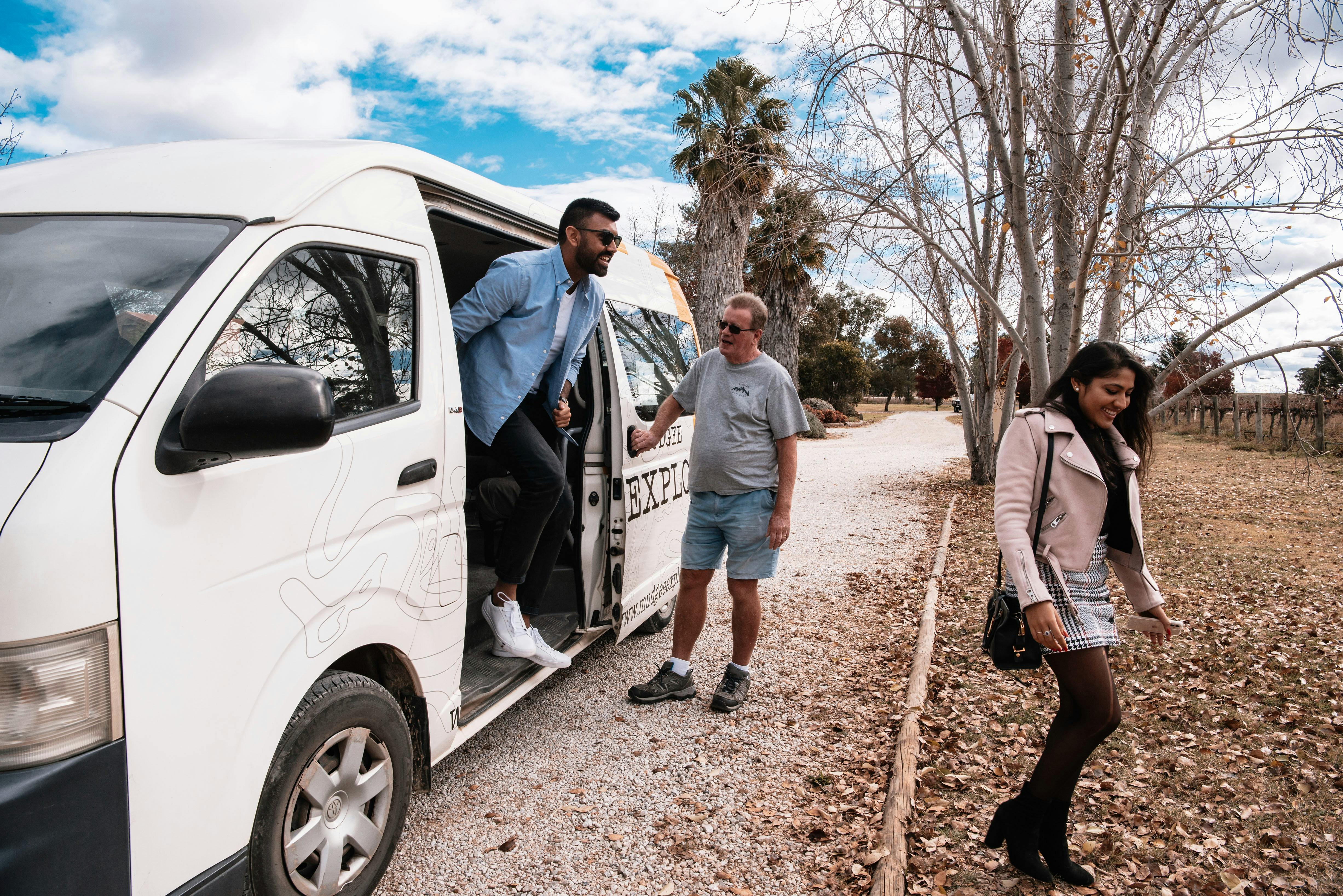 Couple jumping out of bus