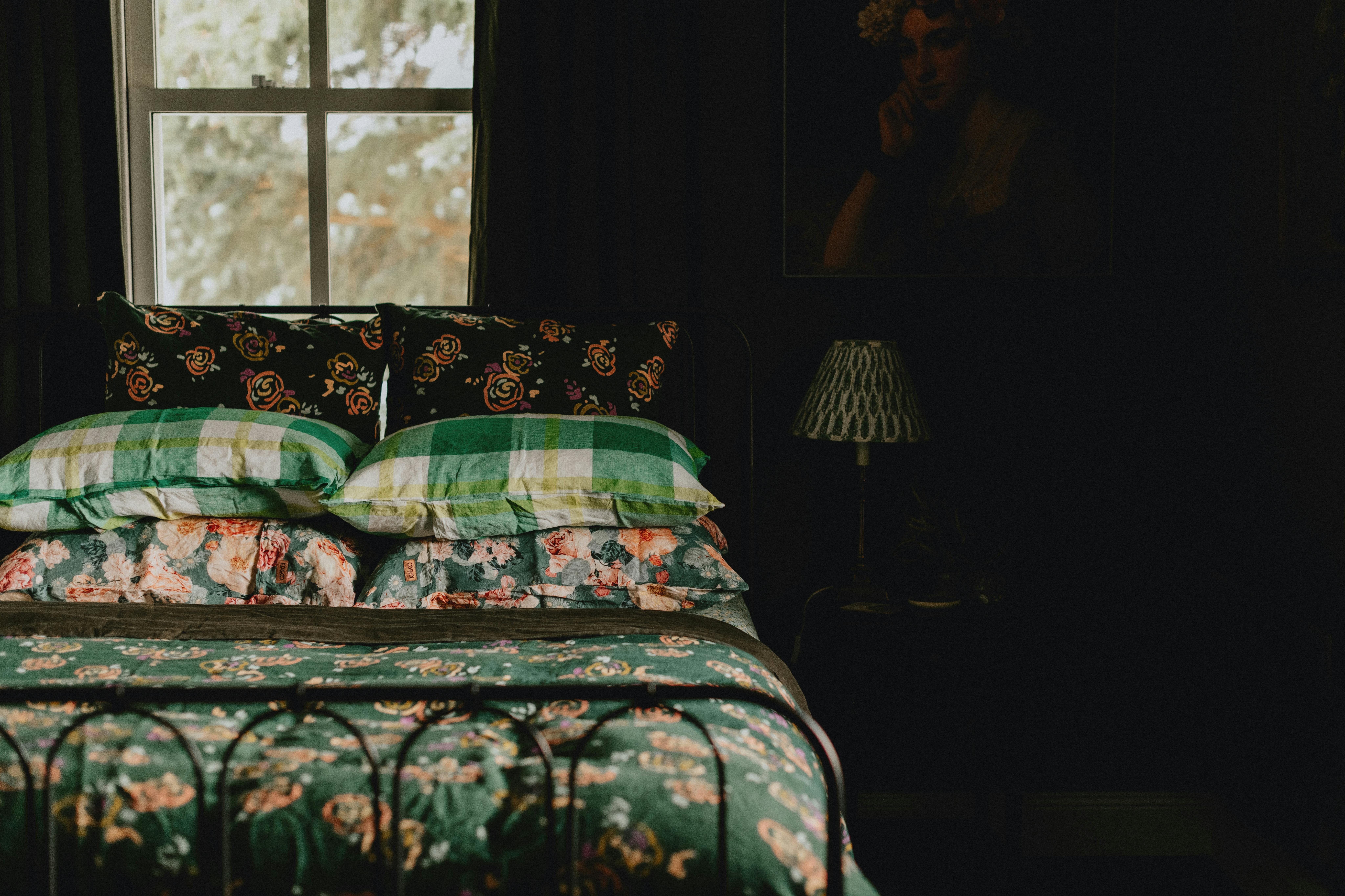 Queen bed in green room