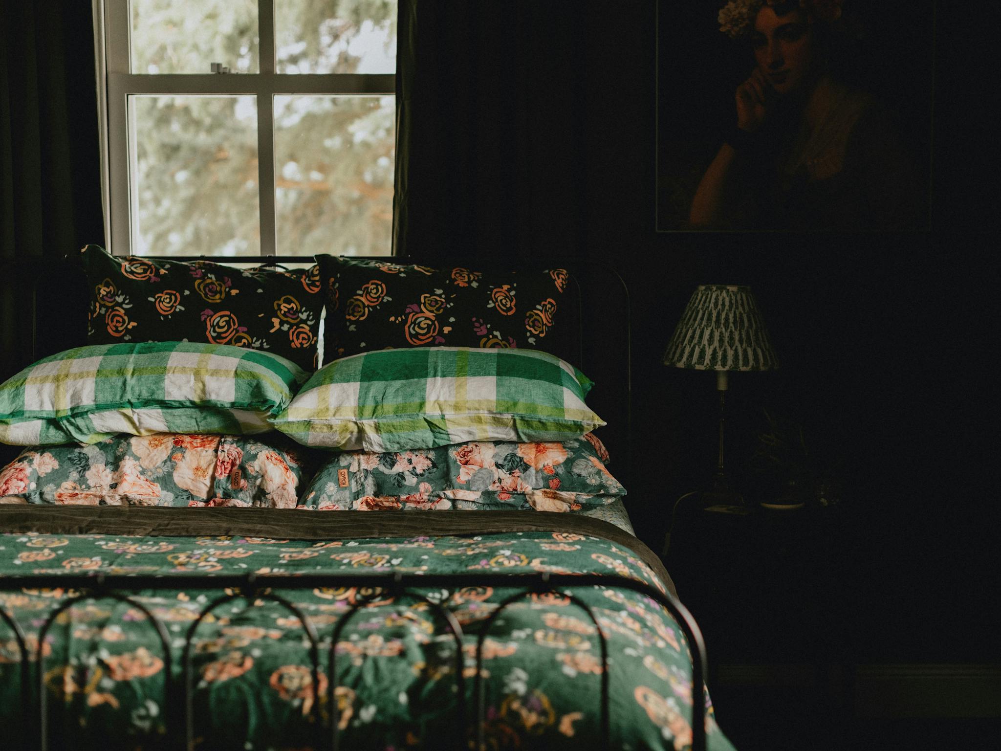 Queen bed in green room