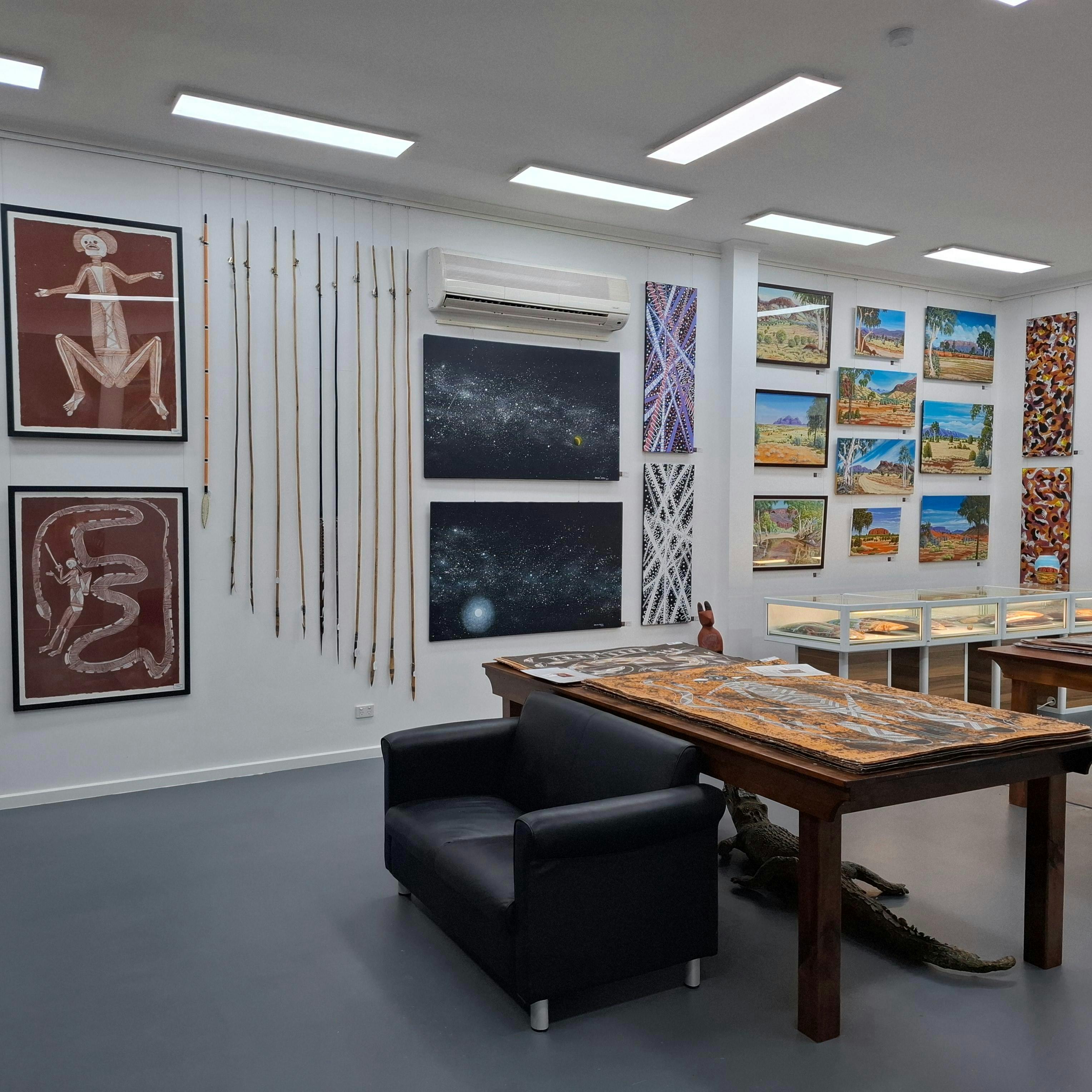 Top end art, artifacts boomerangs, coolamons, clubs woomeras sheilds spears Hermansberg watercolours