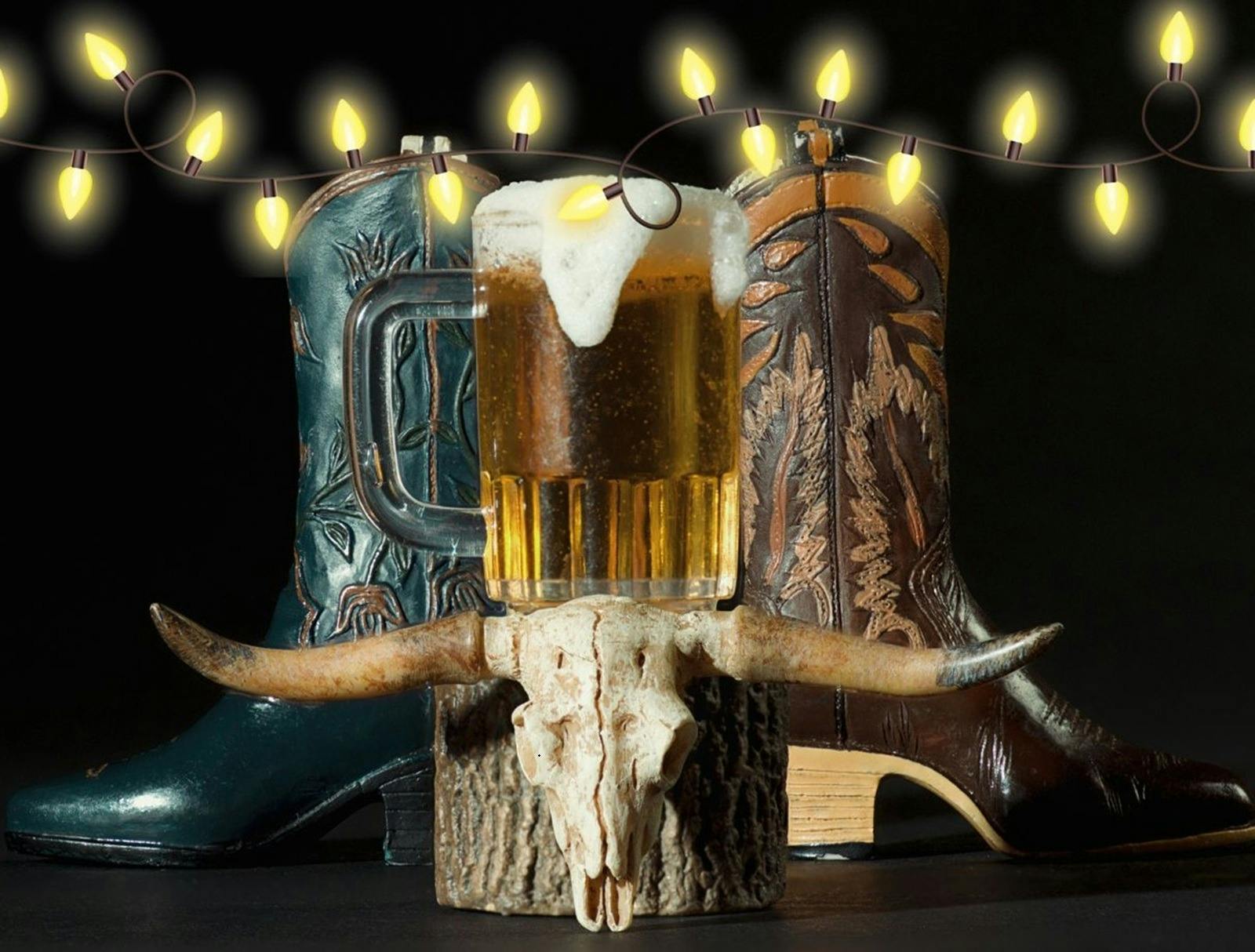 Cowboy boots beer and long horn skull