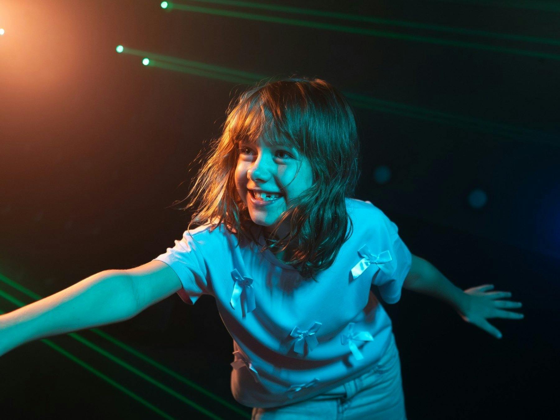 Young girl enjoying an exciting laser challenge at Power Play Sydney's indoor interactive adventure