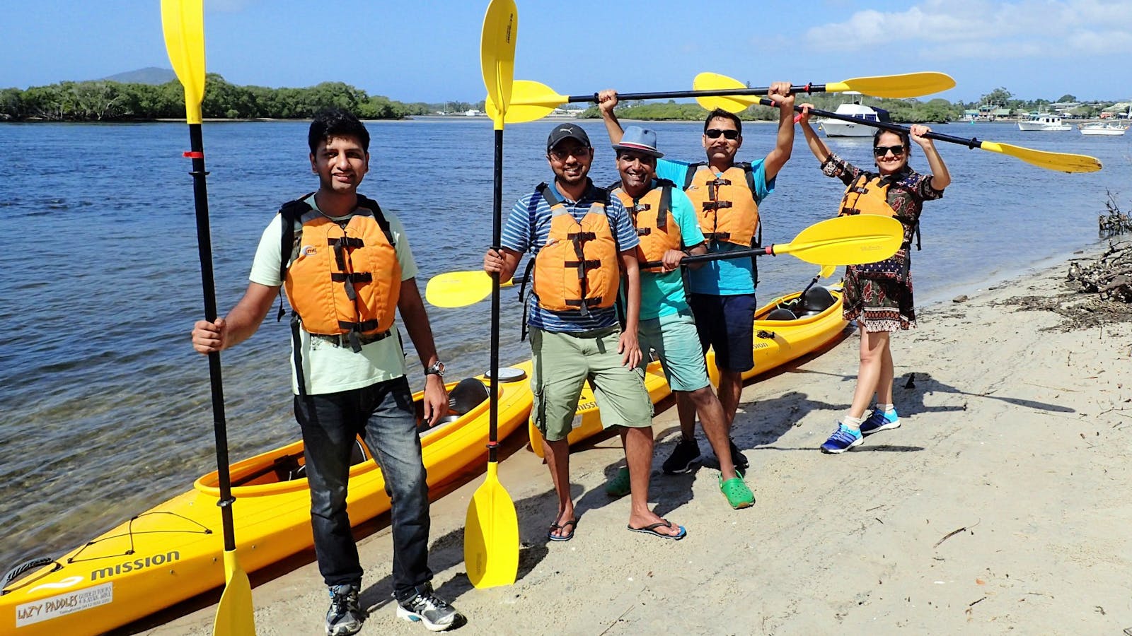 Tour group on beach during guided kayak tour with Lazy Paddles