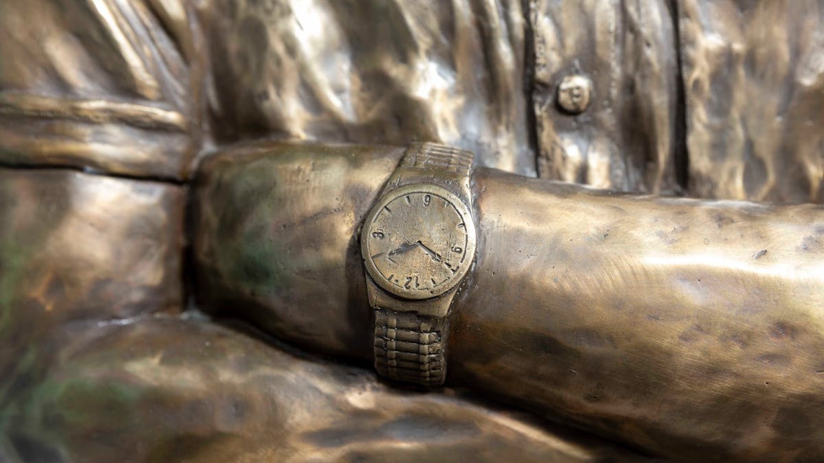 Close up of the detail on the watch of one of the sicilon bronze statues.