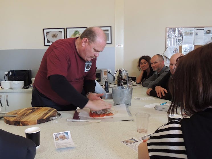 Chef John constructing a Eucumbene truffle trout roulade