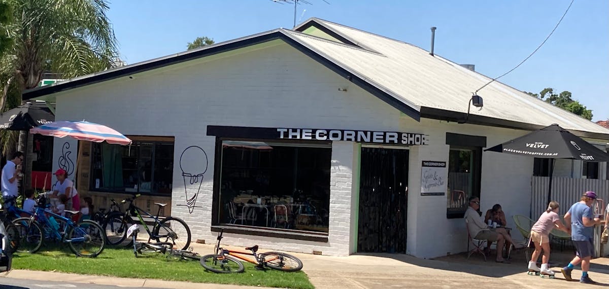 Bicycles and people outside shop