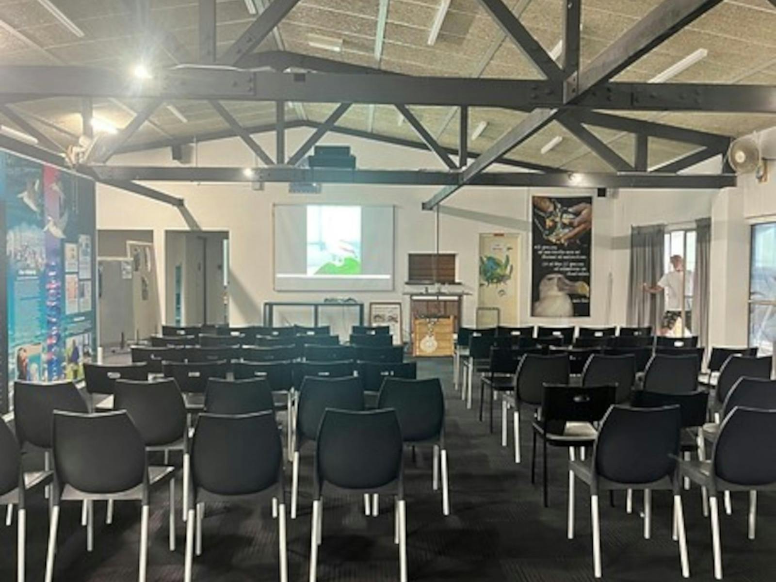 A picture of the inside of the Education Centre with rows of chairs and information posters