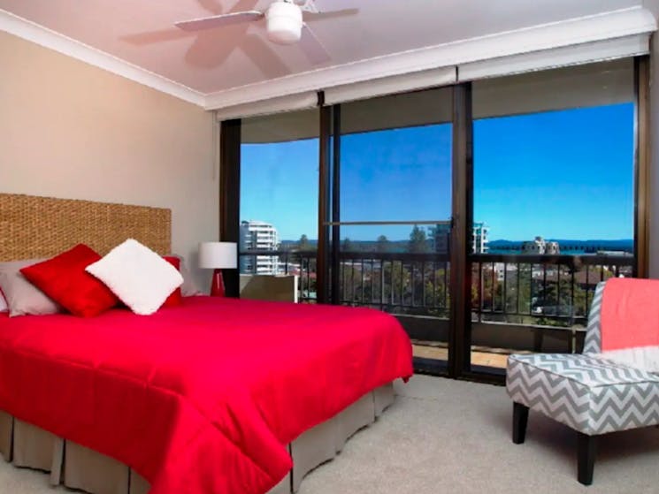 Master bedroom with Queen bed and skyline view
